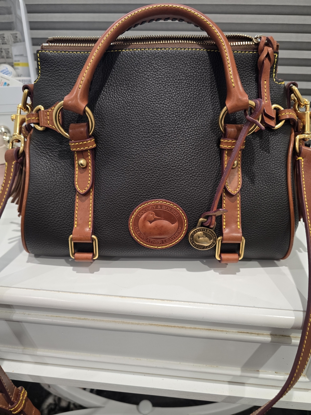 Dooney & Bourke Black Pebble Leather Satchel with Brown Trim and Gold Hardware